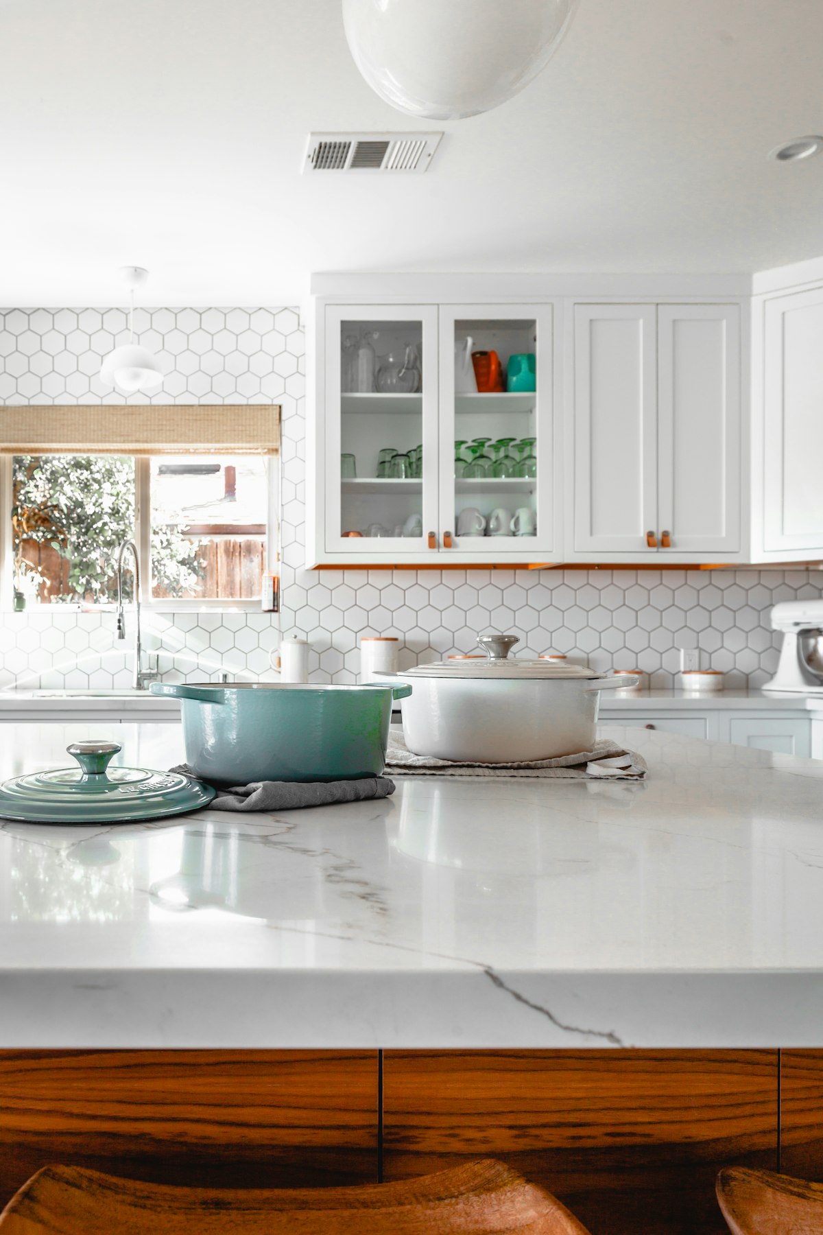 Modern kitchen remodeling with wood cabinets and stone counters